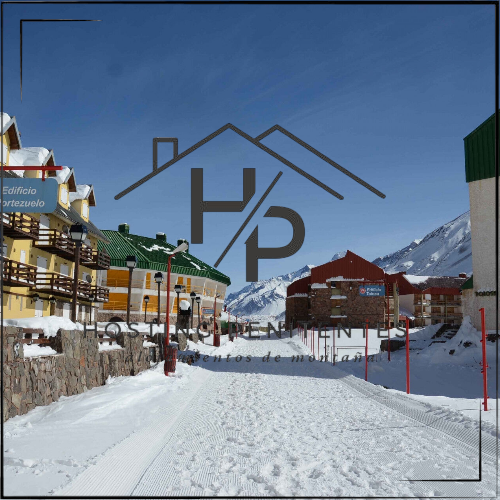 Penitentes en invierno, peatonal con logo Hosting Penitentes